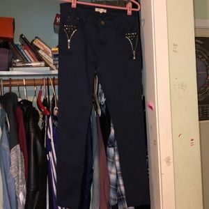 Navy blue pants with detailing on pockets